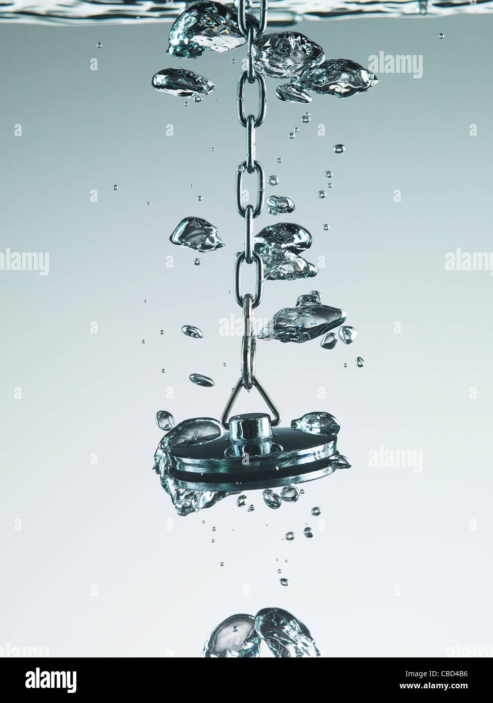 Plug bubbling in water Stock Photo