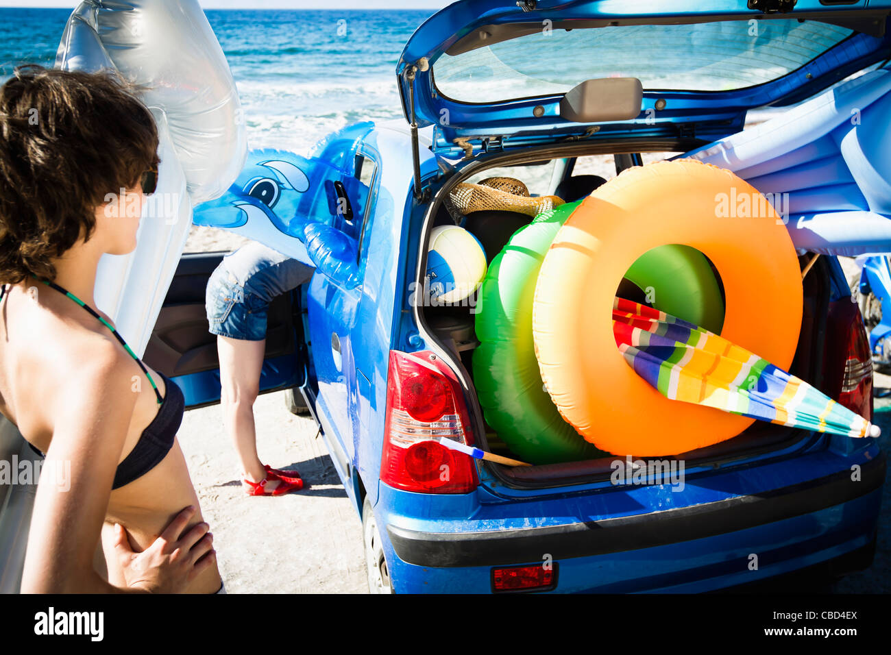 Woman bending car on hi-res stock photography and images - Alamy