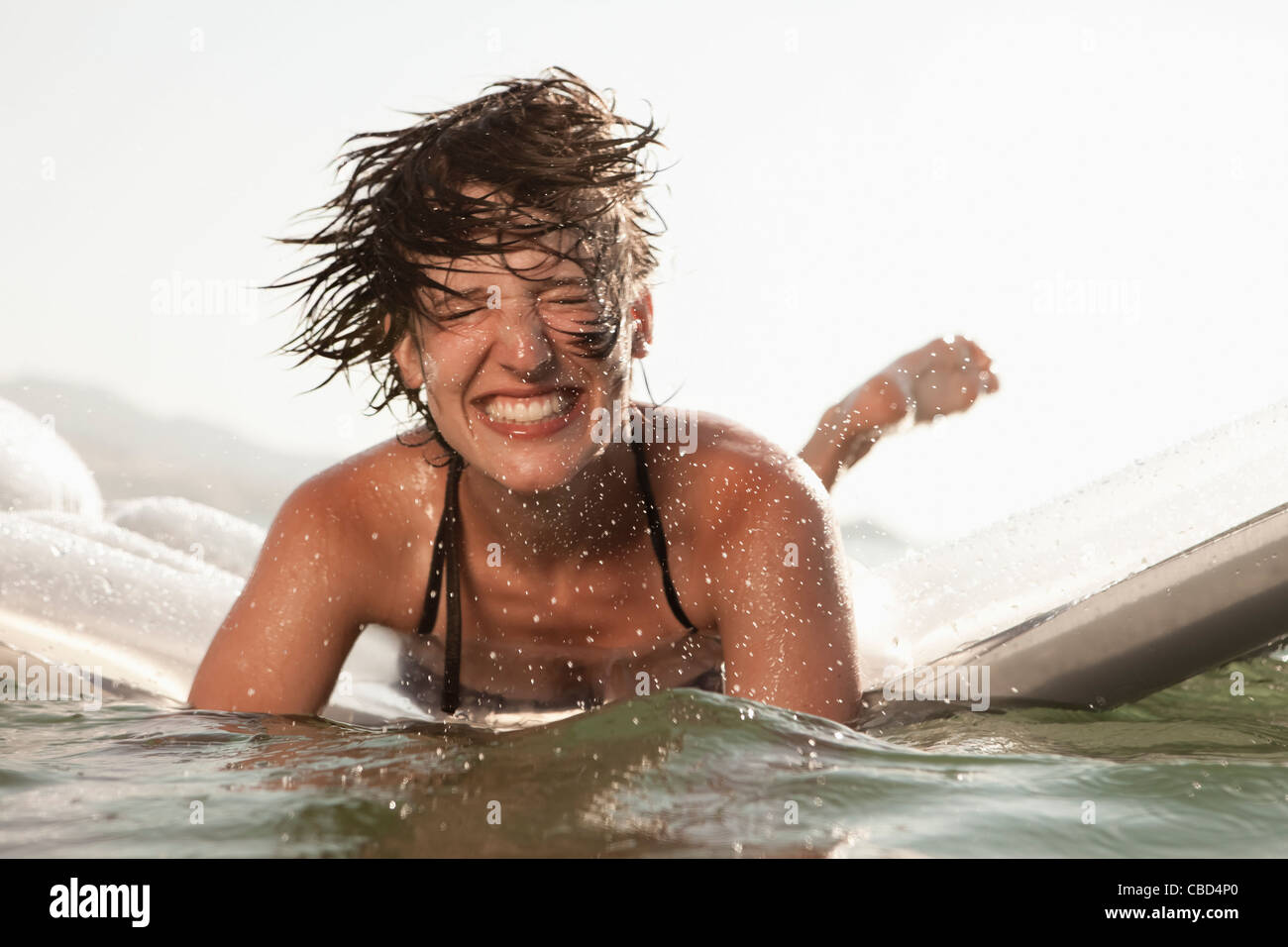 Woman floating natural pool outdoors hi-res stock photography and images picture