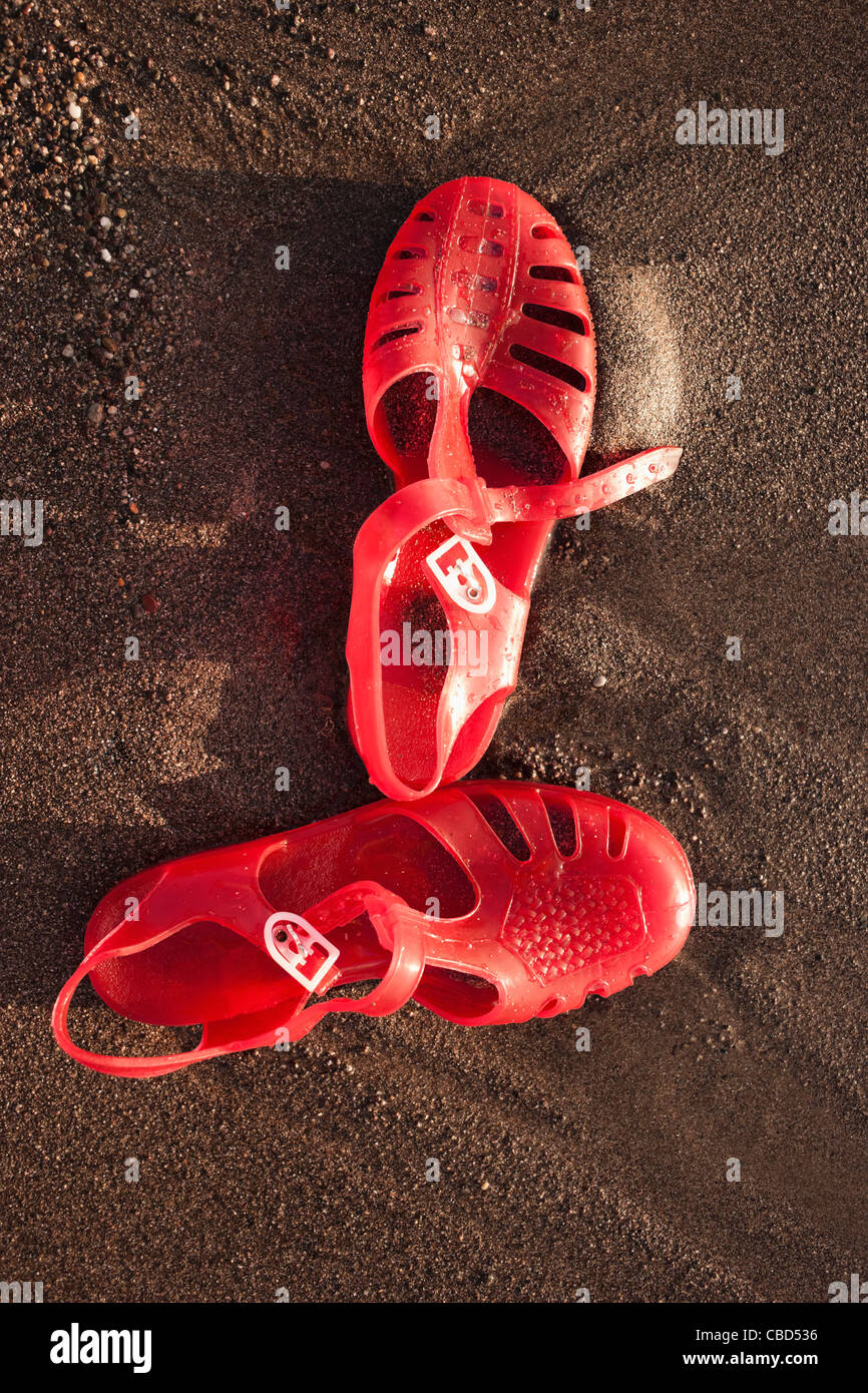 Close up of sandals on beach Stock Photo