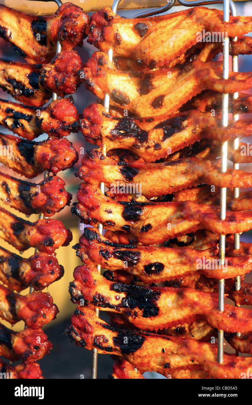 BBQ chicken wings for sale at wet market on Kota Kinabalu waterfront. Stock Photo