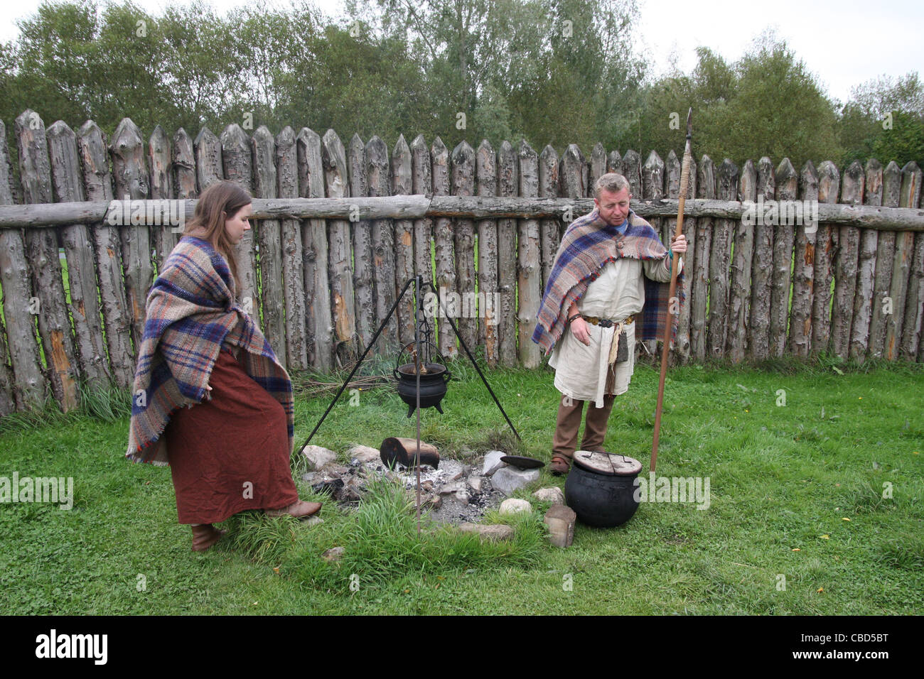 Celtic characters at the reconstruction of the Iron age dwelling at the Navan centre and fort near Armagh  in Northern Ireland. Stock Photo