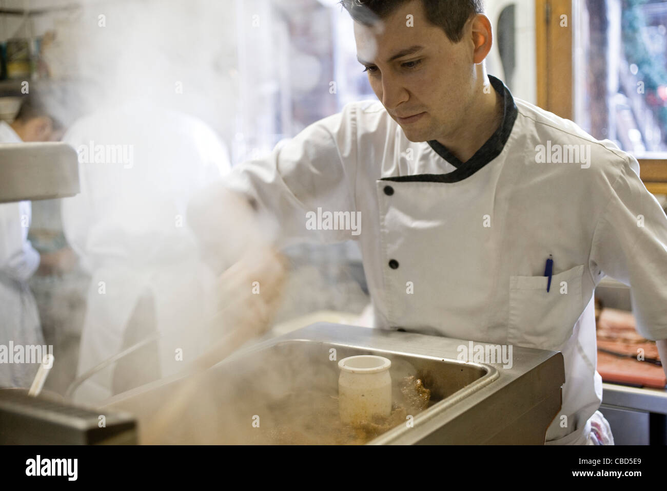 Chef preparing gravy Stock Photo