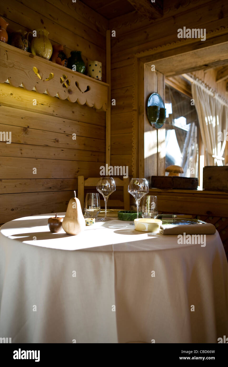 Place settings and glasses on dining table Stock Photo