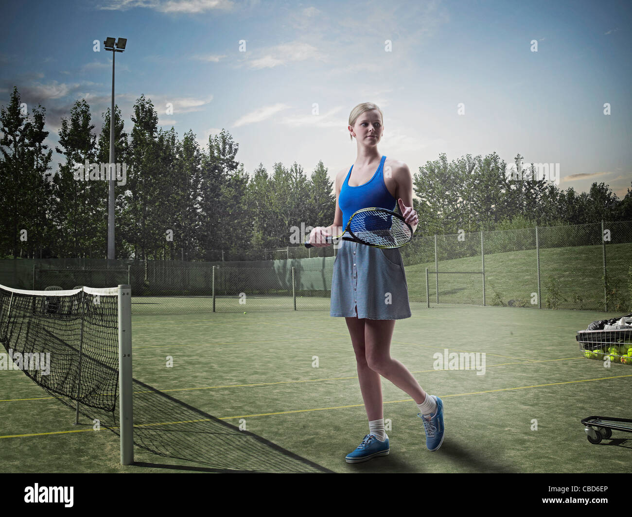 Woman Standing On Tennis Court Stock Photo Alamy