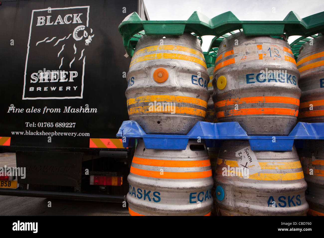 UK, England, Yorkshire, Masham, Black Sheep Brewery, aluminium casks of beer stacked in loading area Stock Photo