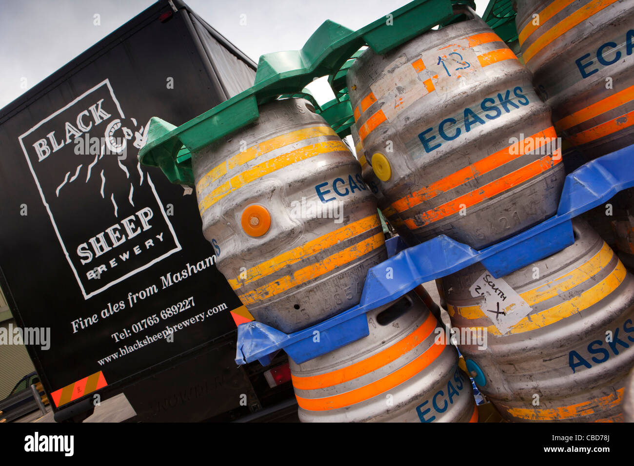 UK, England, Yorkshire, Masham, Black Sheep Brewery, aluminium casks of beer stacked in loading area Stock Photo