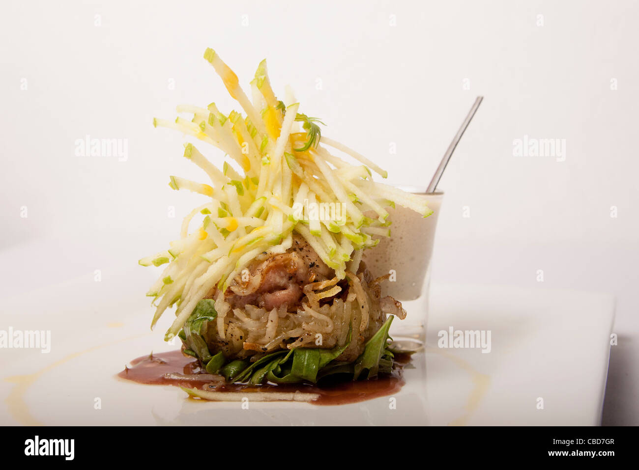 Sweetbreads topped with Granny Smith apple and port wine gravy Stock Photo