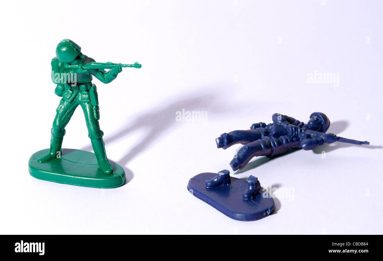 Plastic Toy Soldiers, Army figures fighting on a white background Stock Photo
