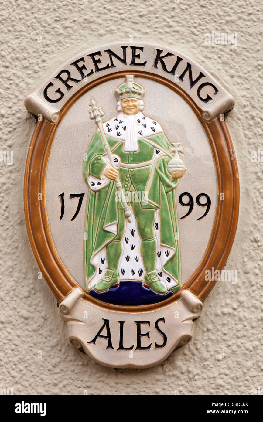 UK, England, Bedfordshire, Woburn, Bedford Street, Ceramic Greene King Brewery sign on wall of Bell Hotel Stock Photo