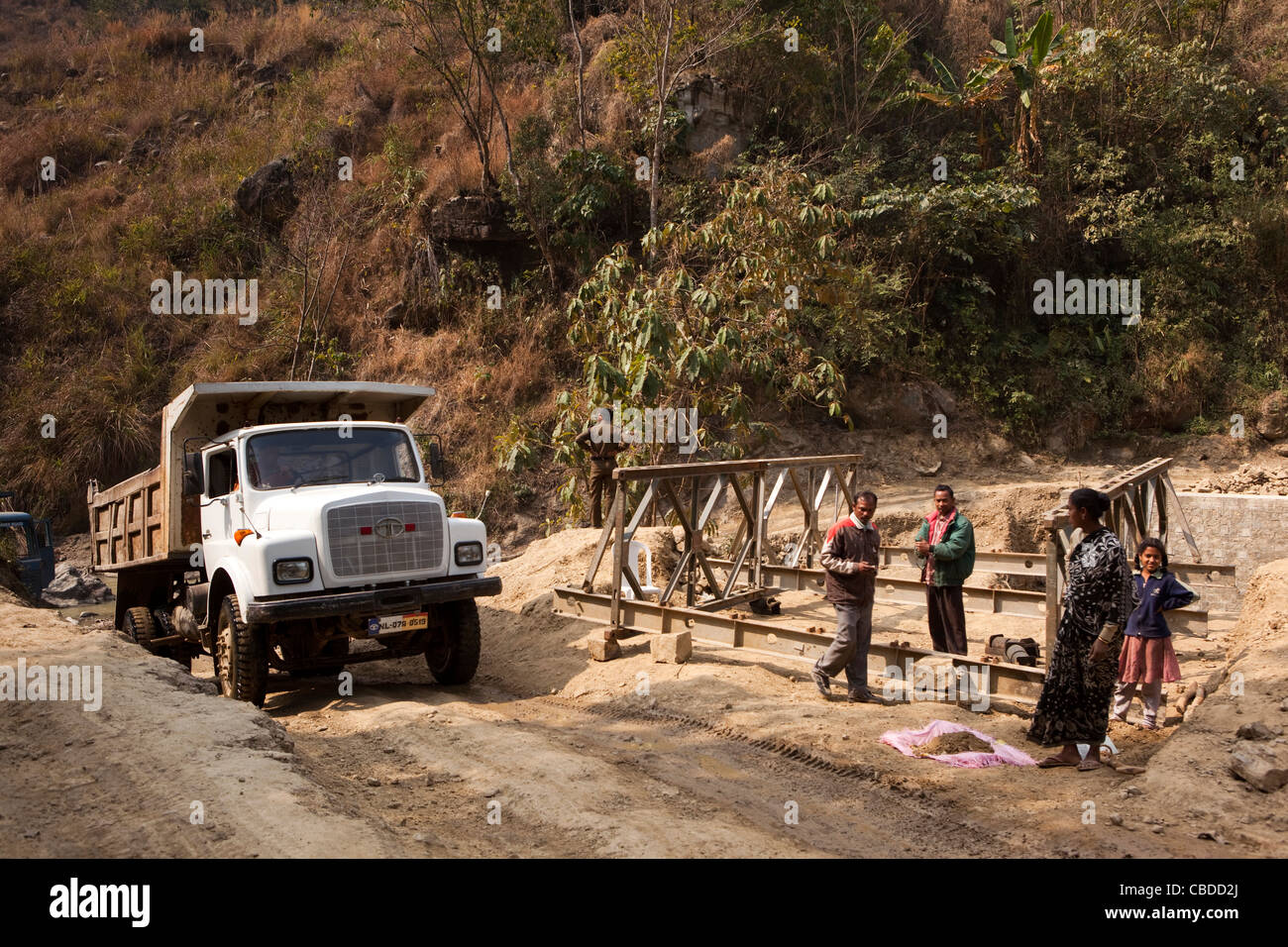 India, Nagaland, Khonoma, tata truck rising from river ford where bridge is being constructed Stock Photo