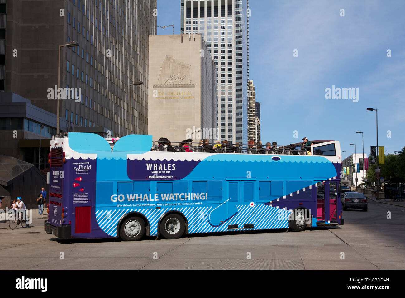 Double decked tour bus turning from Michigan Avenue east onto Randolph St. Chicago, Illinois. Stock Photo