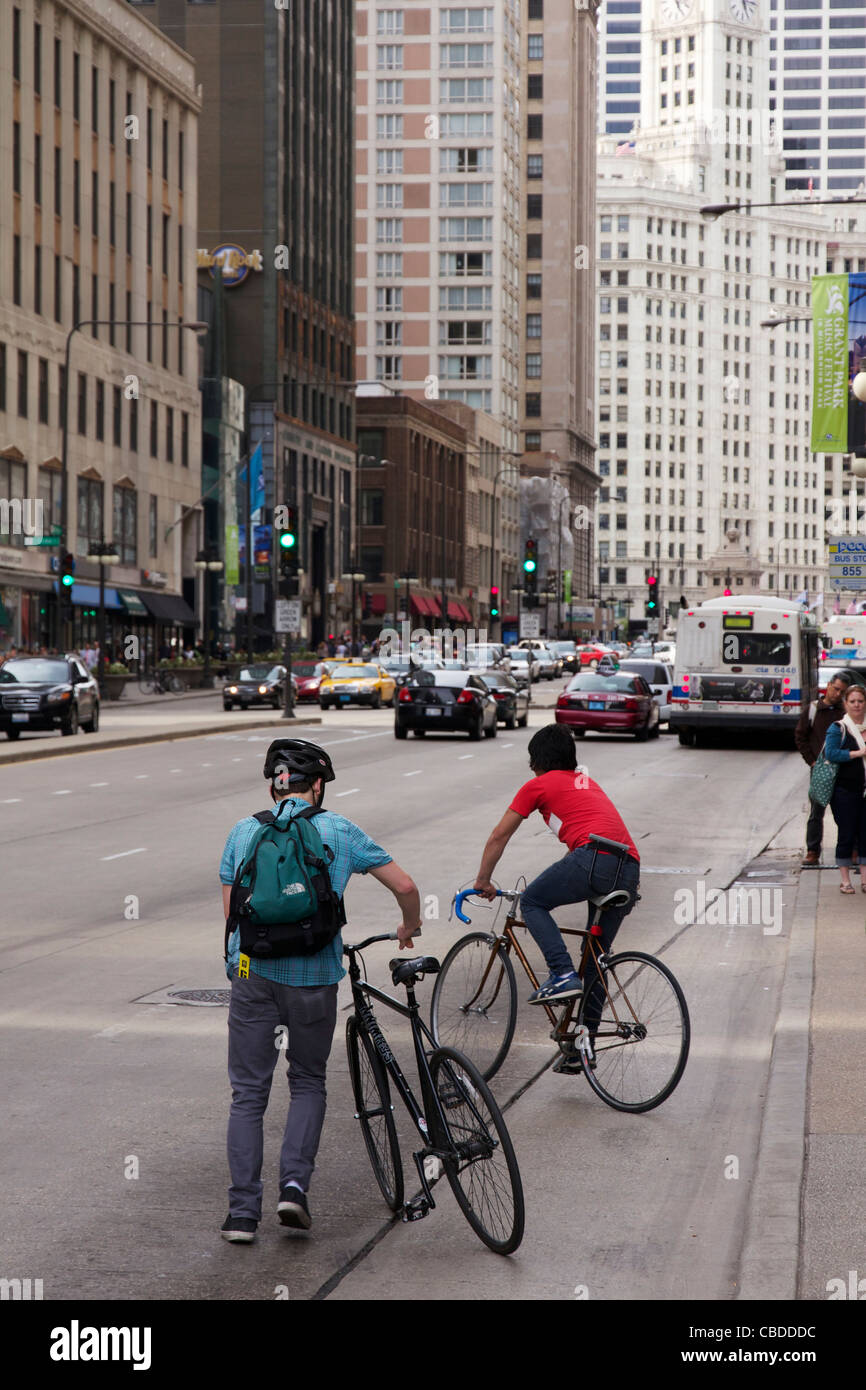 Two men riding bicycles Michigan Avenue Chicago Illinois Stock Photo