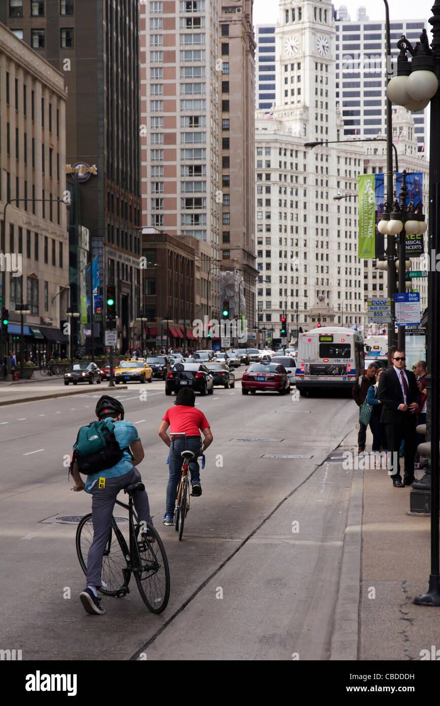 Two men riding bicycles Michigan Avenue Chicago Illinois Stock Photo