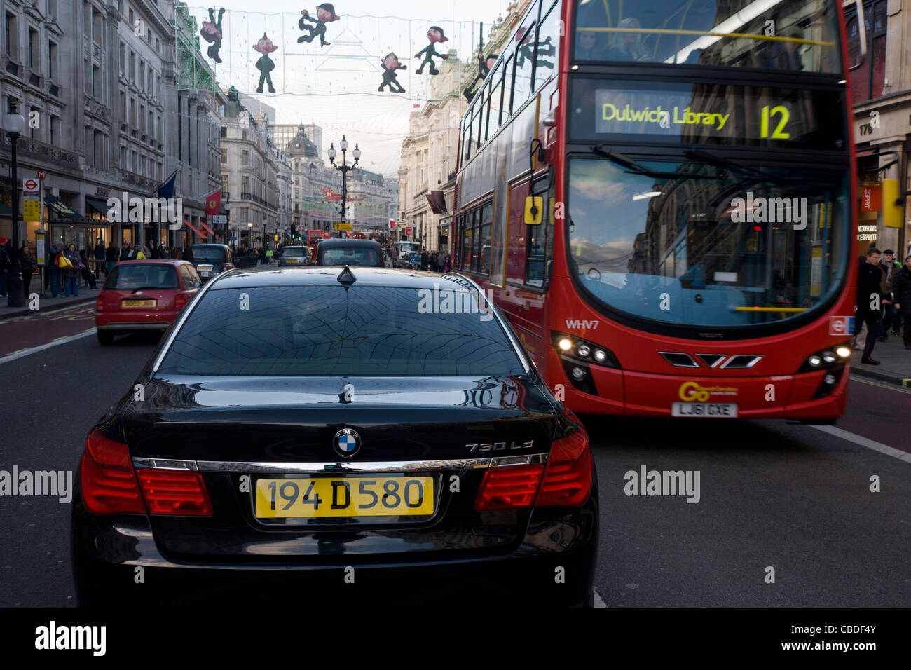 A black BMW diplomatic car is illegally parked in the middle taxi lane ...