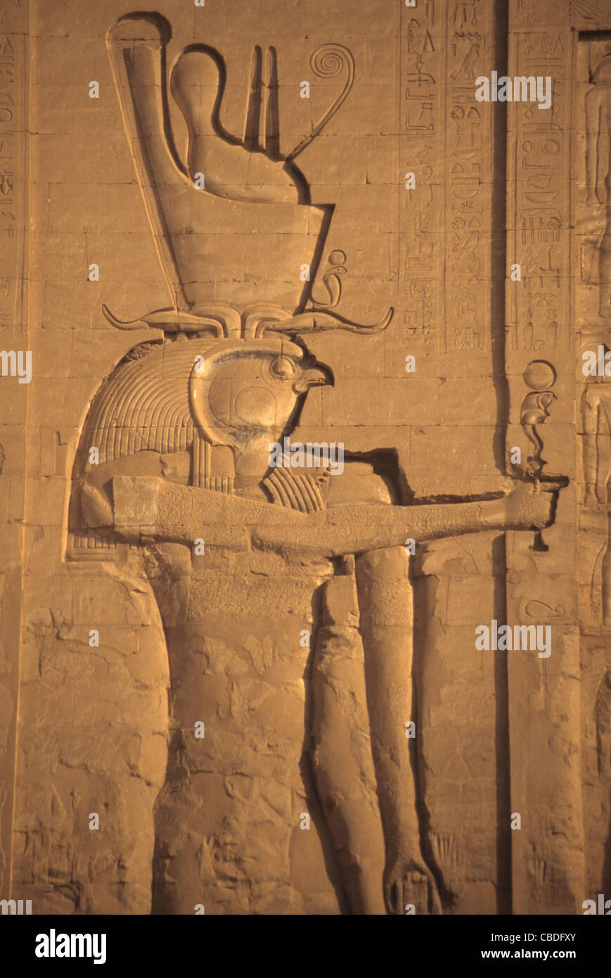 Pharaoh as Horus, detail temple pylon, Edfu Egypt Stock Photo