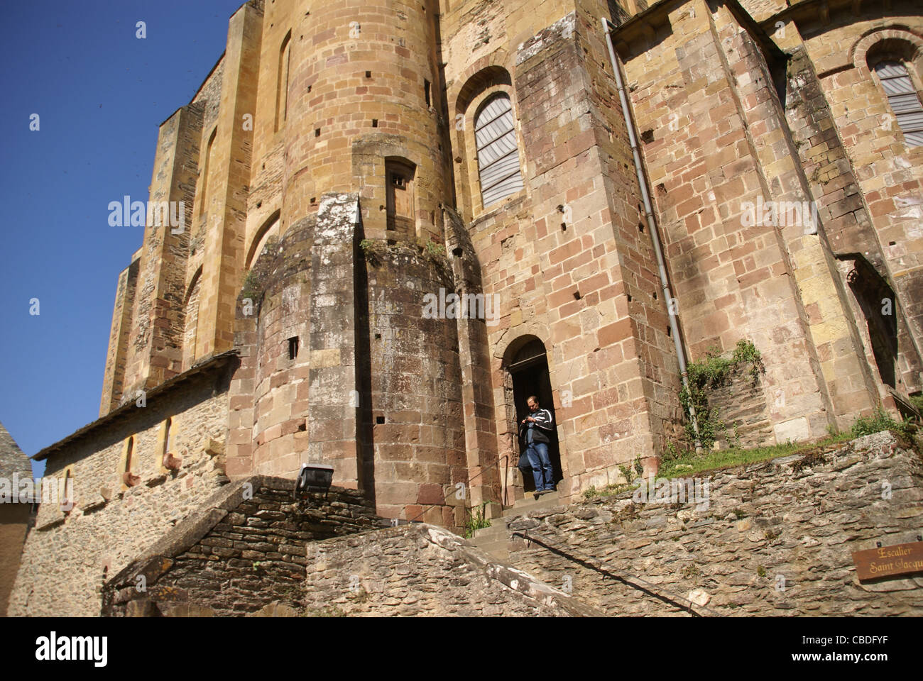 Romanesque tower and walls  of the Abbey Church of St. Foy, Conques, France Stock Photo