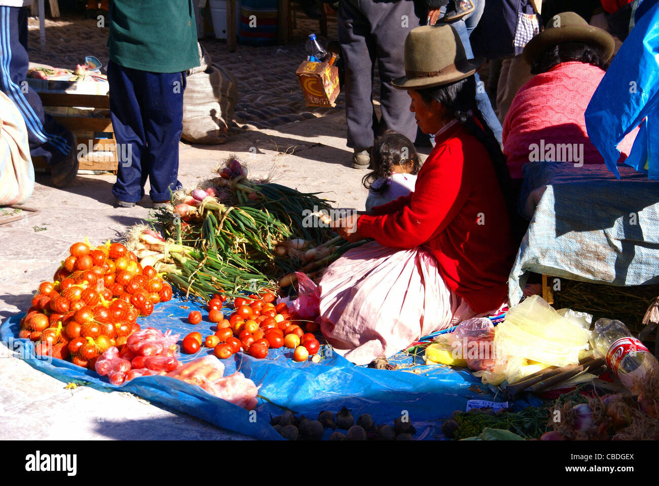 Indian woman selling vegetables, Pisac market, Cusco, Peru, South America Stock Photo