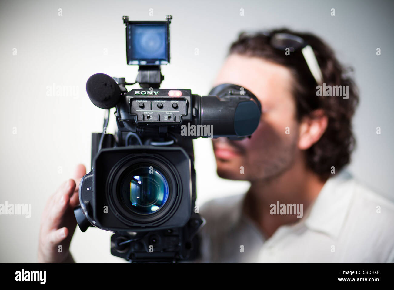 Cameraman with camera. TV, news, journalism, video, recoring, record