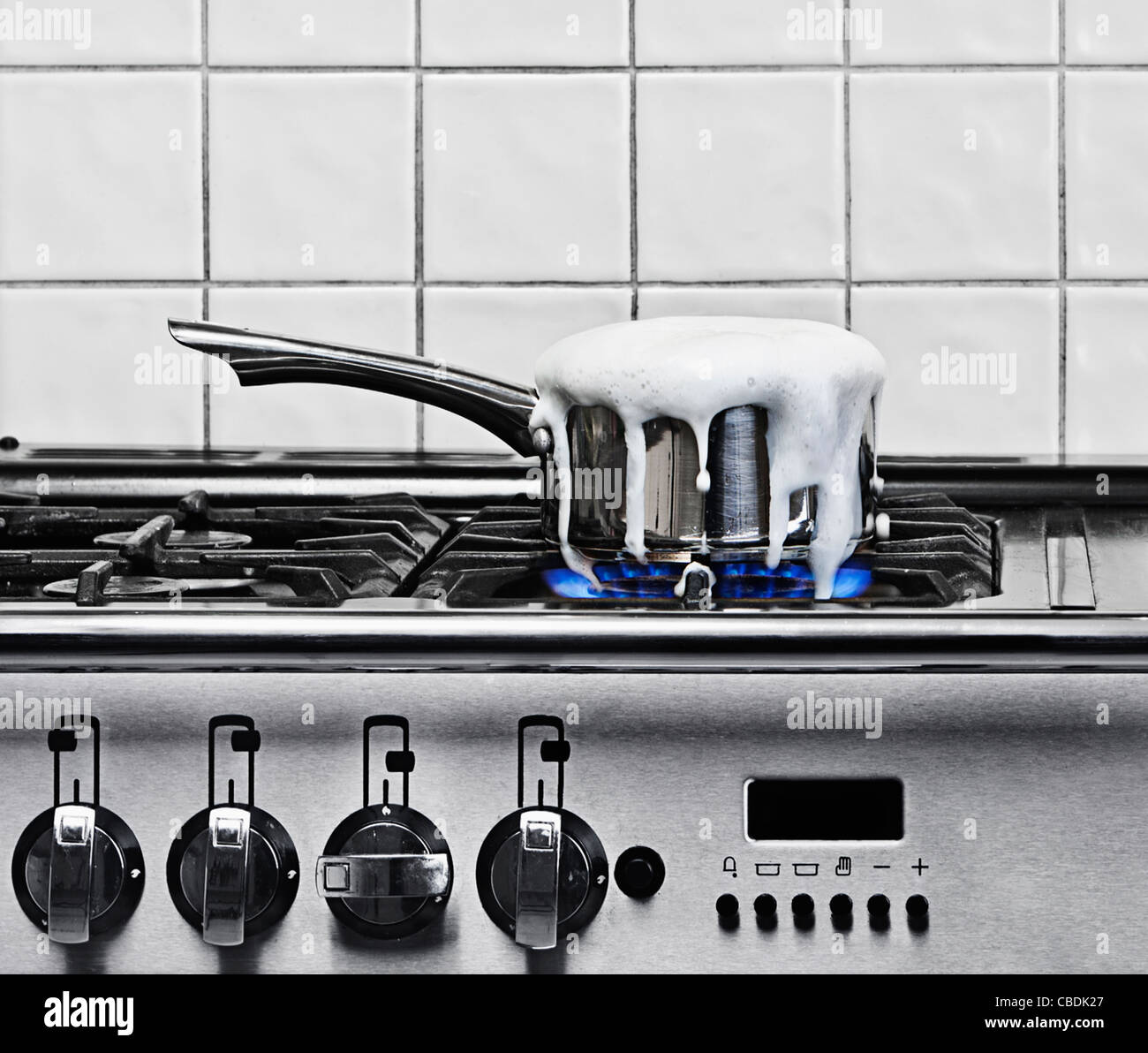 Pan Boiling Over on Gas Hob Stock Photo Alamy