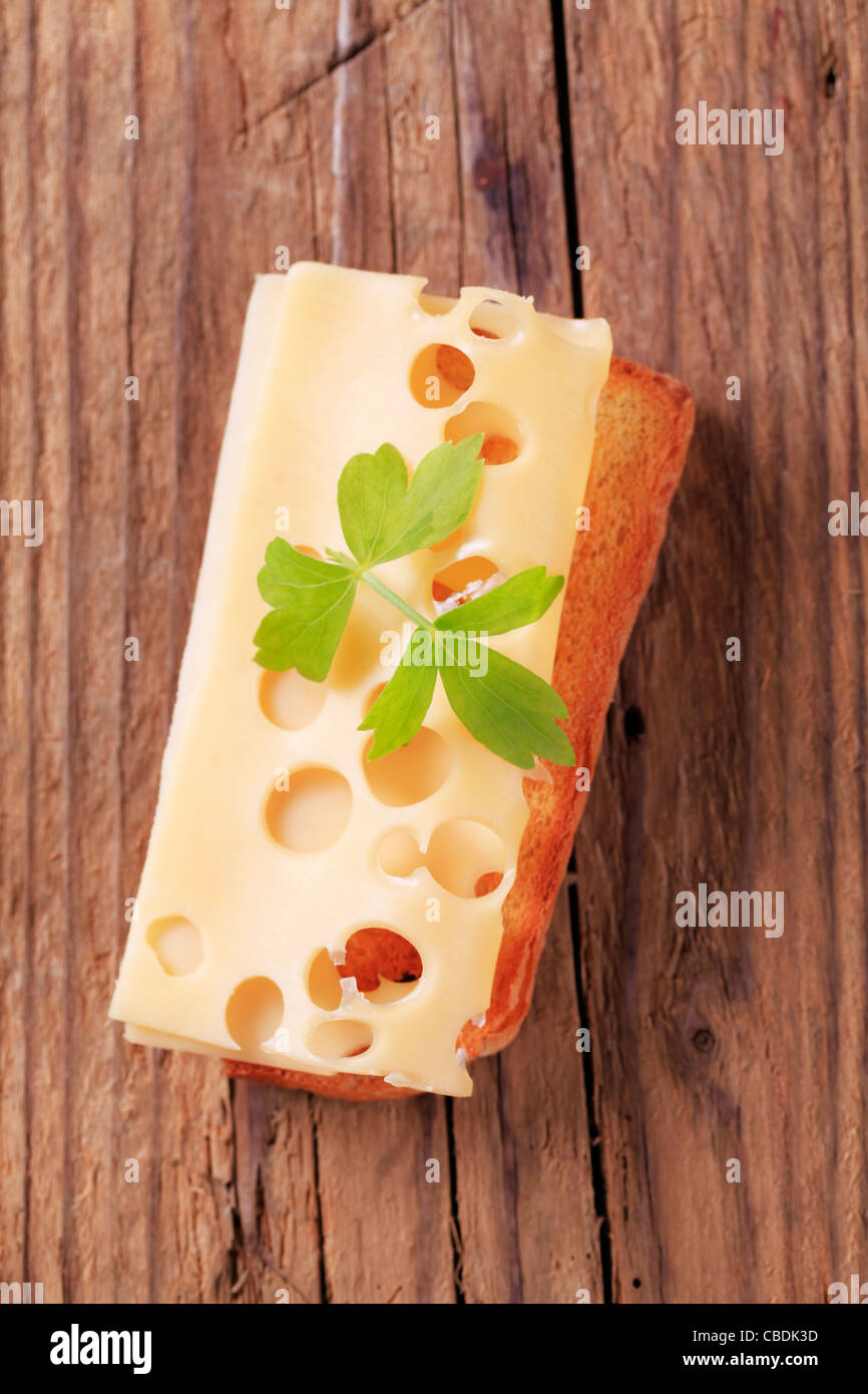 Thin slice of Emmentaler cheese on toast Stock Photo