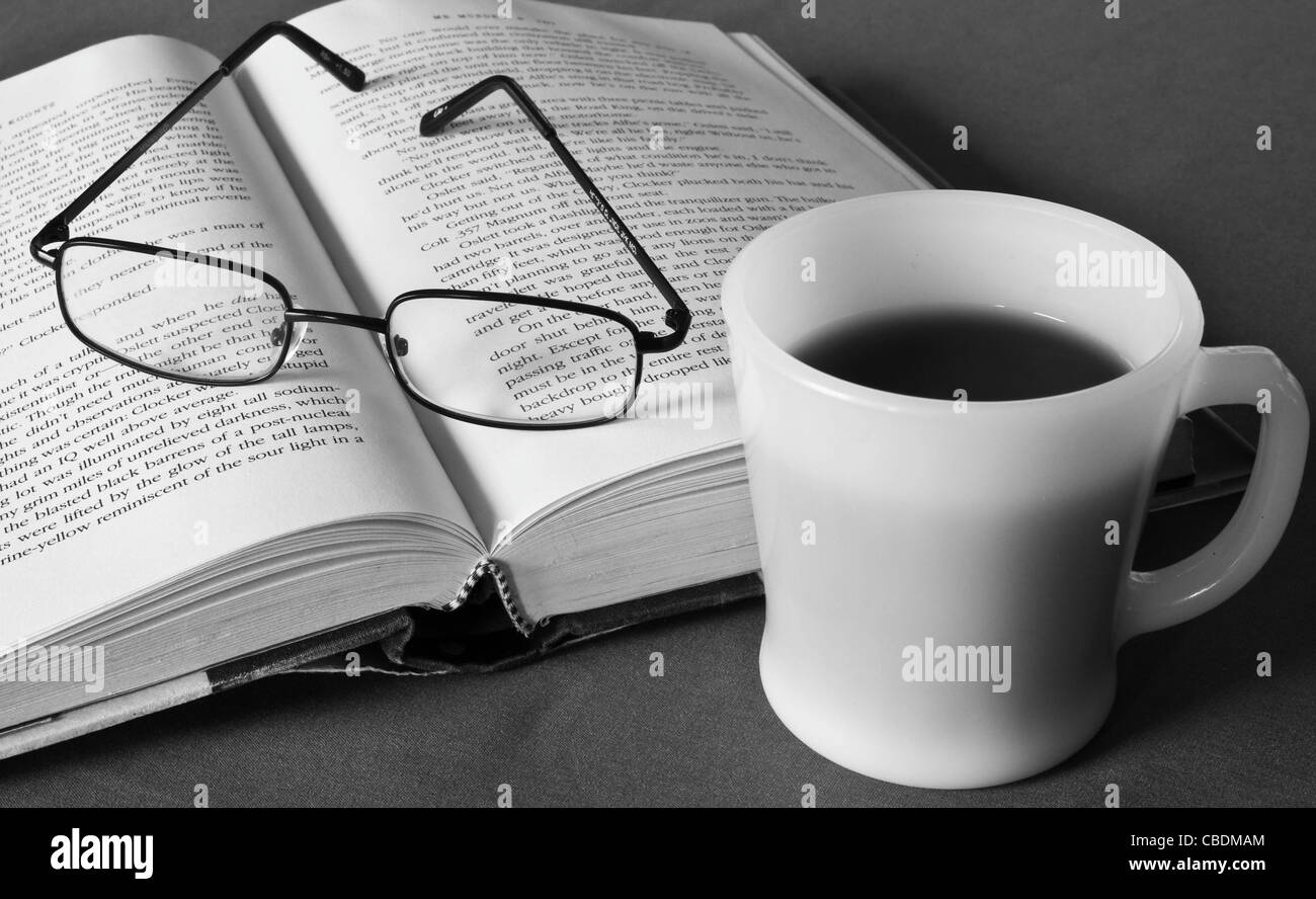 Relaxing with a good book and a cup of coffee Stock Photo - Alamy