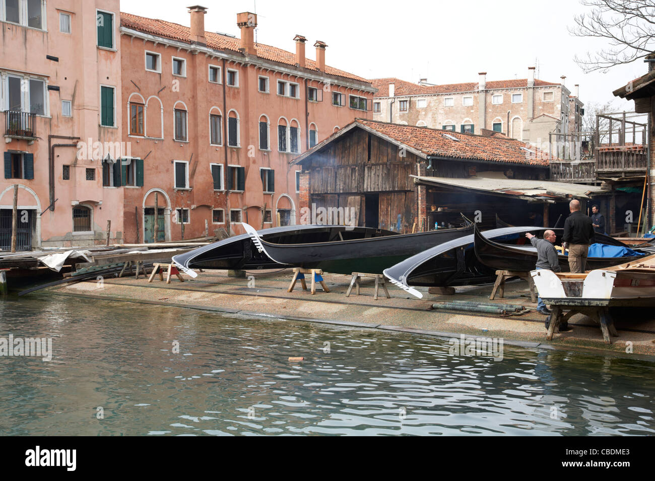 Gondola boat builder on canal in Venice Stock Photo