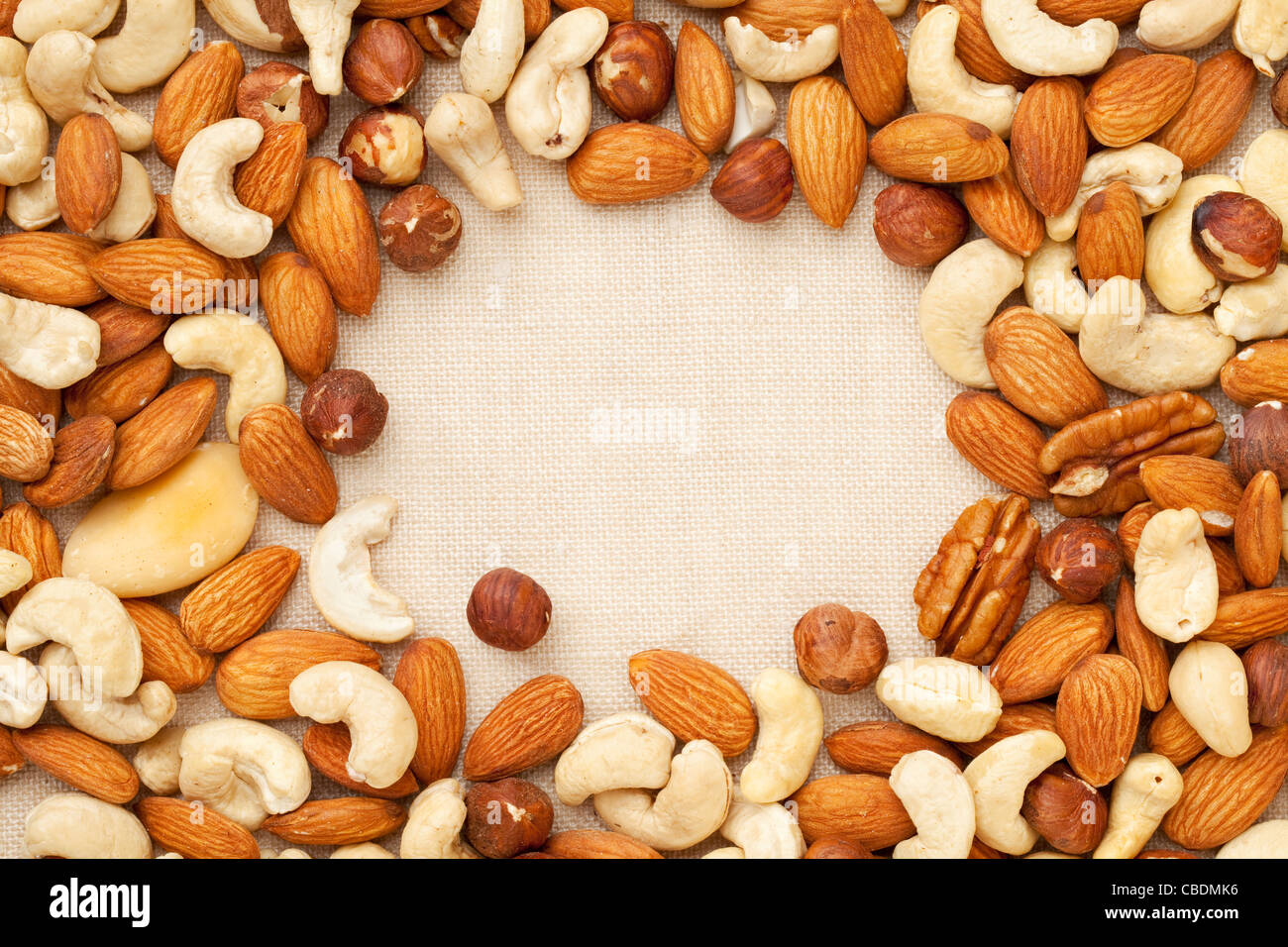 nut mix (walnut, almond, brazilian, hazelnut, cashew) on canvas with a copy space Stock Photo
