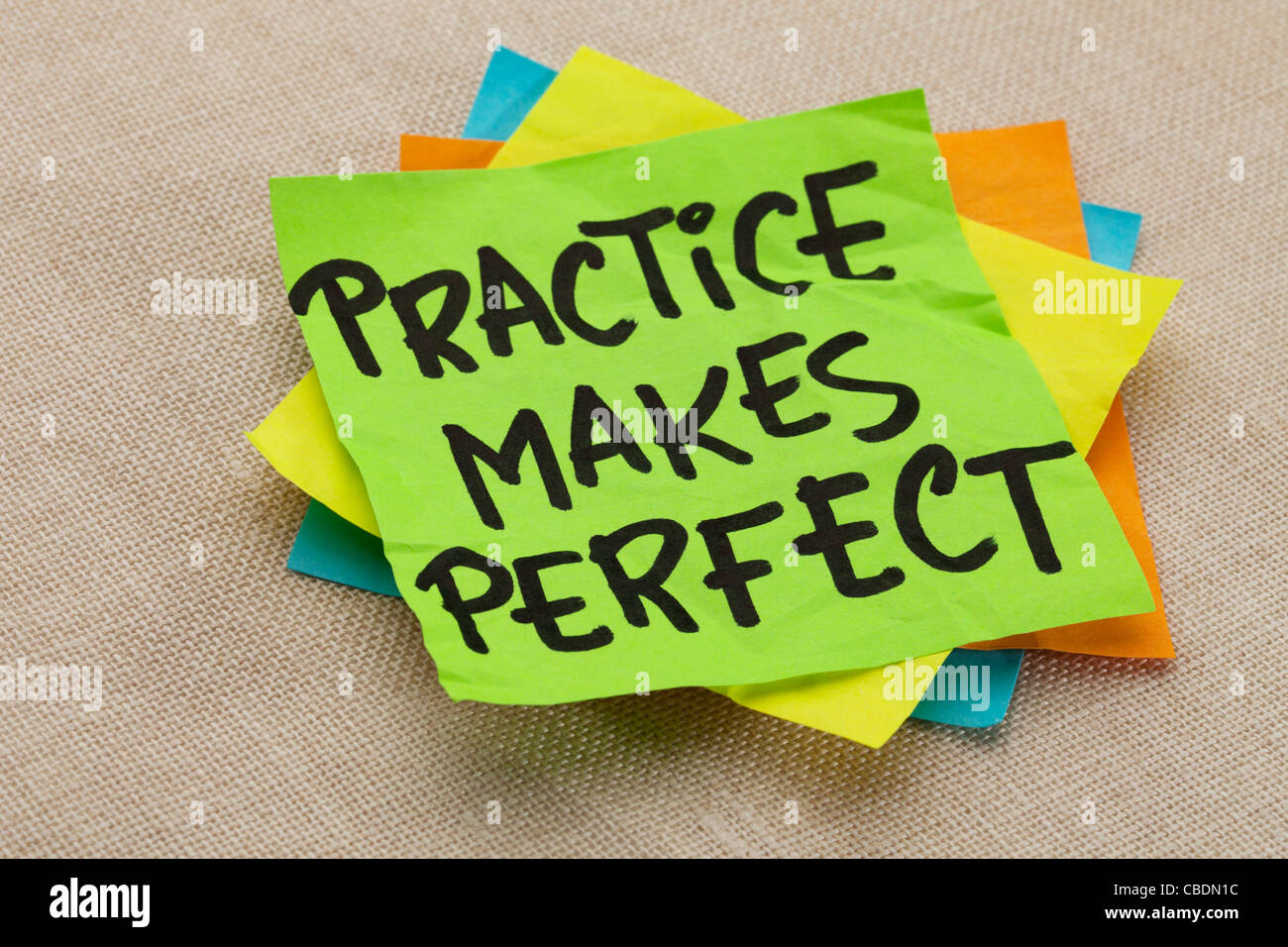 practice makes perfect - a motivational slogan on a green stocky note Stock Photo
