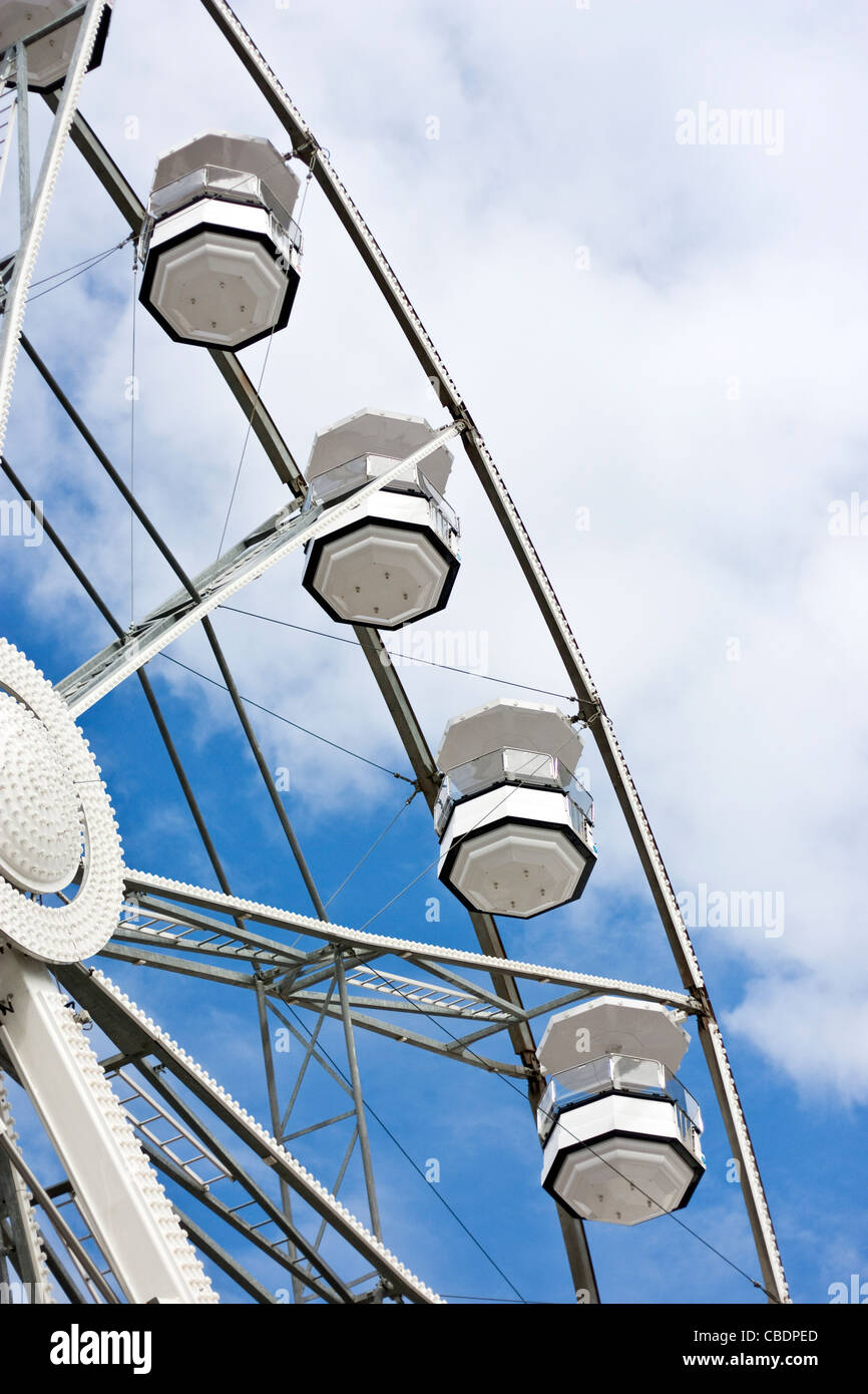 White ferris wheel and cloudy sky Stock Photo - Alamy