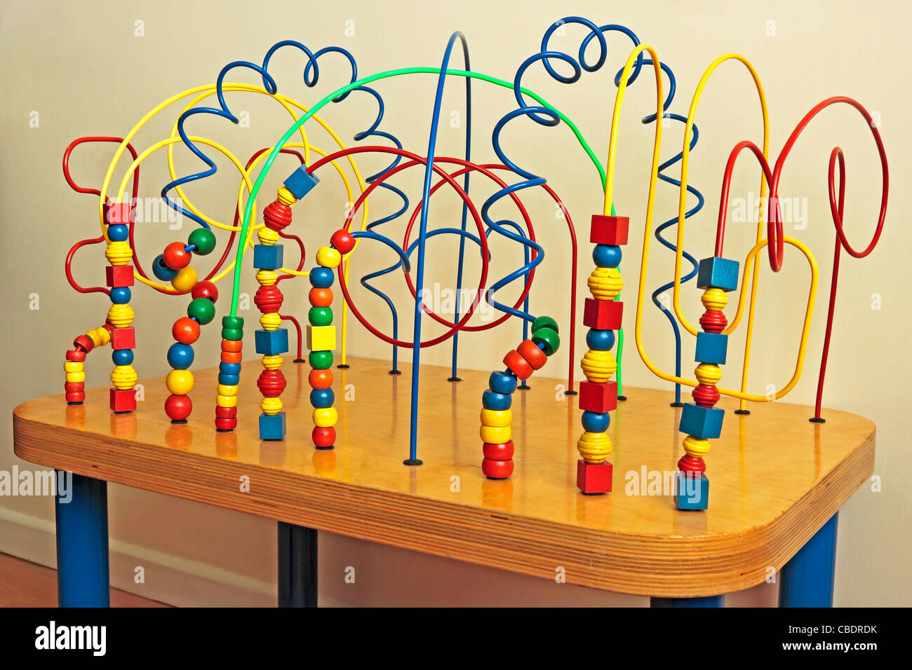 Child's Activity Centre with coloured wires and beads Stock Photo