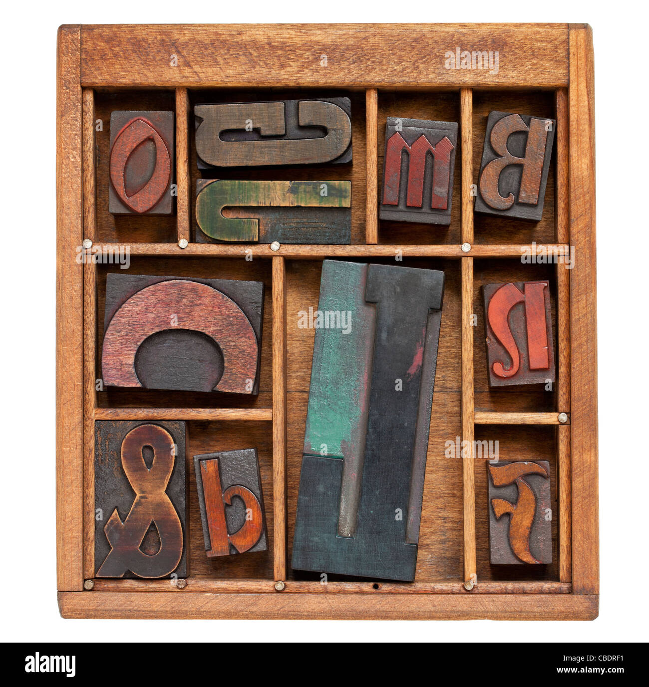 a variety of vintage letterpress printing blocks with big letter L in a small wooden typesetter box Stock Photo