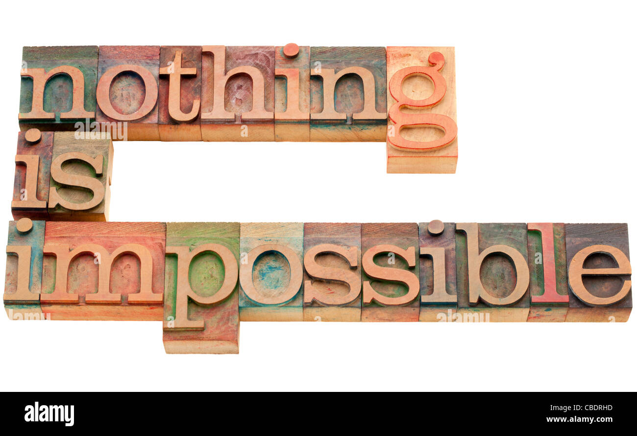 nothing is impossible - motivation concept - isolated text in vintage wood letterpress printing blocks Stock Photo