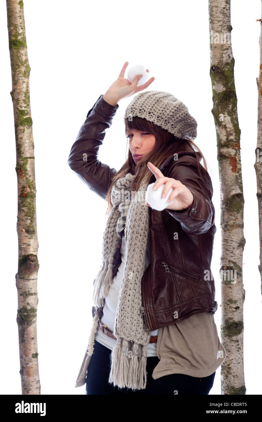 young woman throwing snow balls Stock Photo Alamy