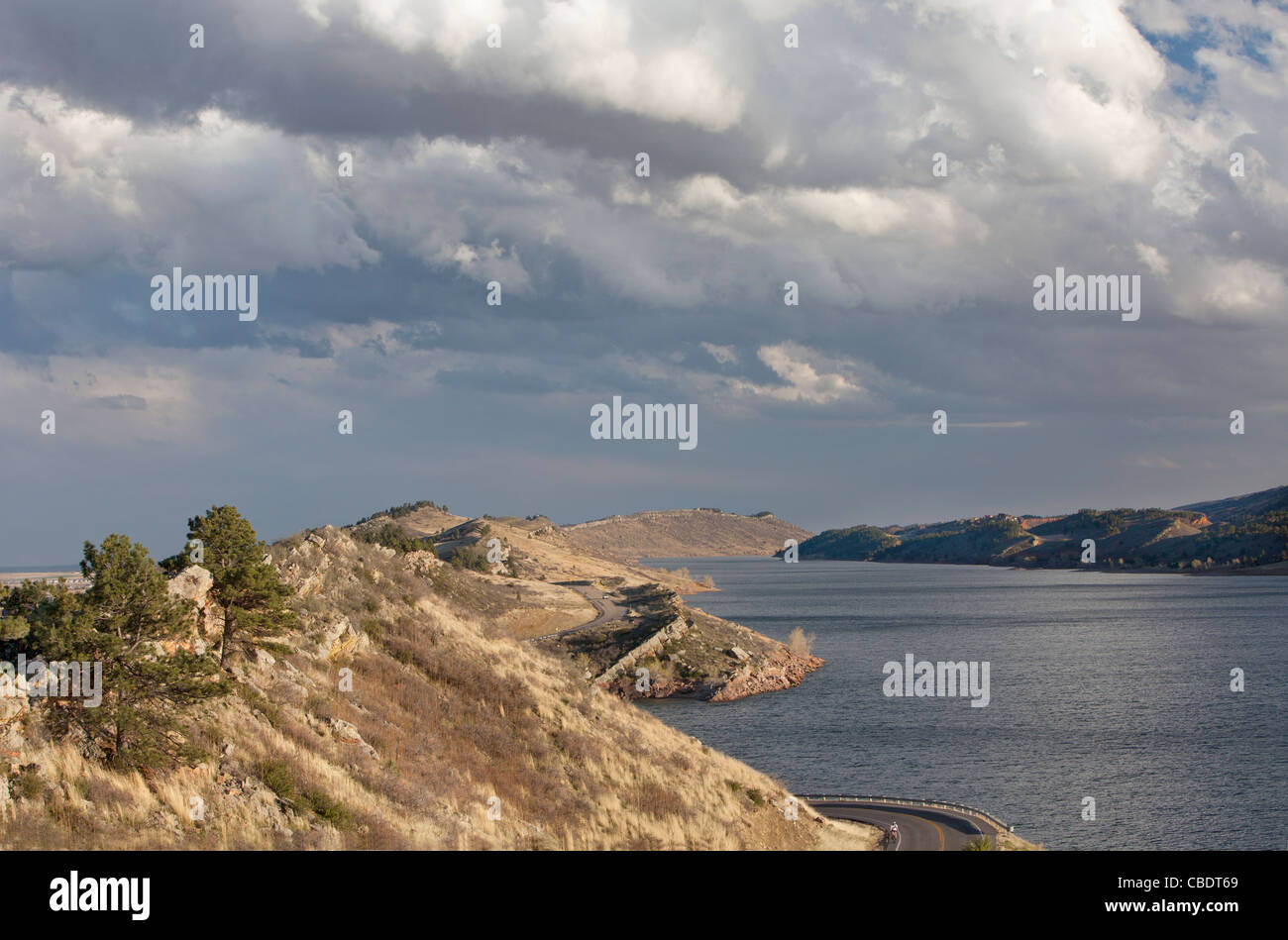 Horsetooth Reservoir with Centennial highway near Fort Collins, Colorado, high wind conditions and heavy clouds in early spring Stock Photo