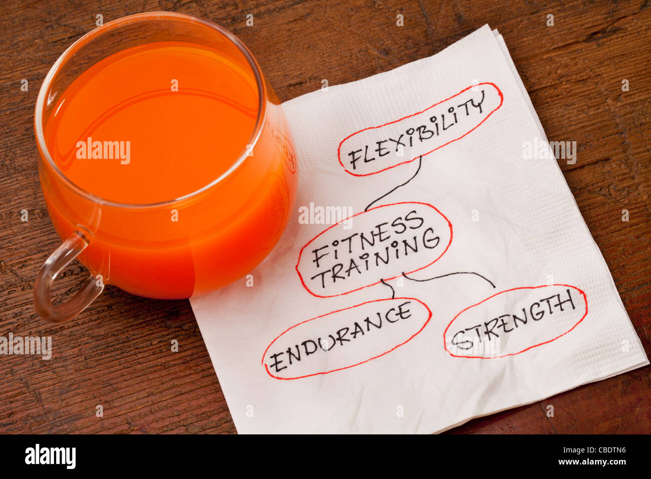 health concept - fitness training - napkin doodle with a glass cup of carrot juice Stock Photo