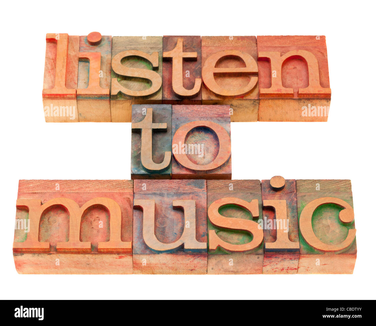 listen to music inspirational suggestion in vintage wood letterpress printing blocks, isolated on white Stock Photo