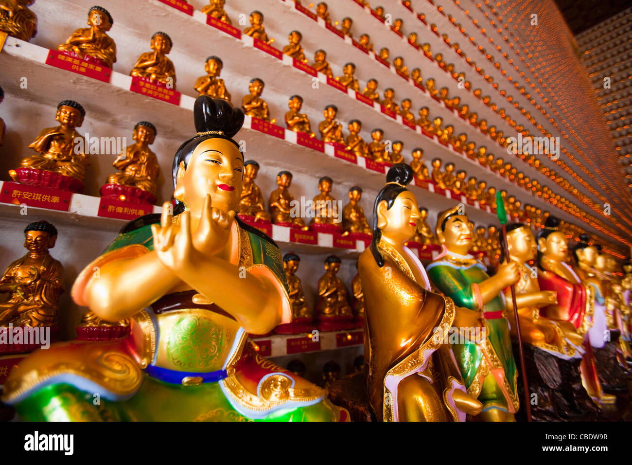 Colorful buddha statues in Chinese shop, Hong Kong, China Stock Photo