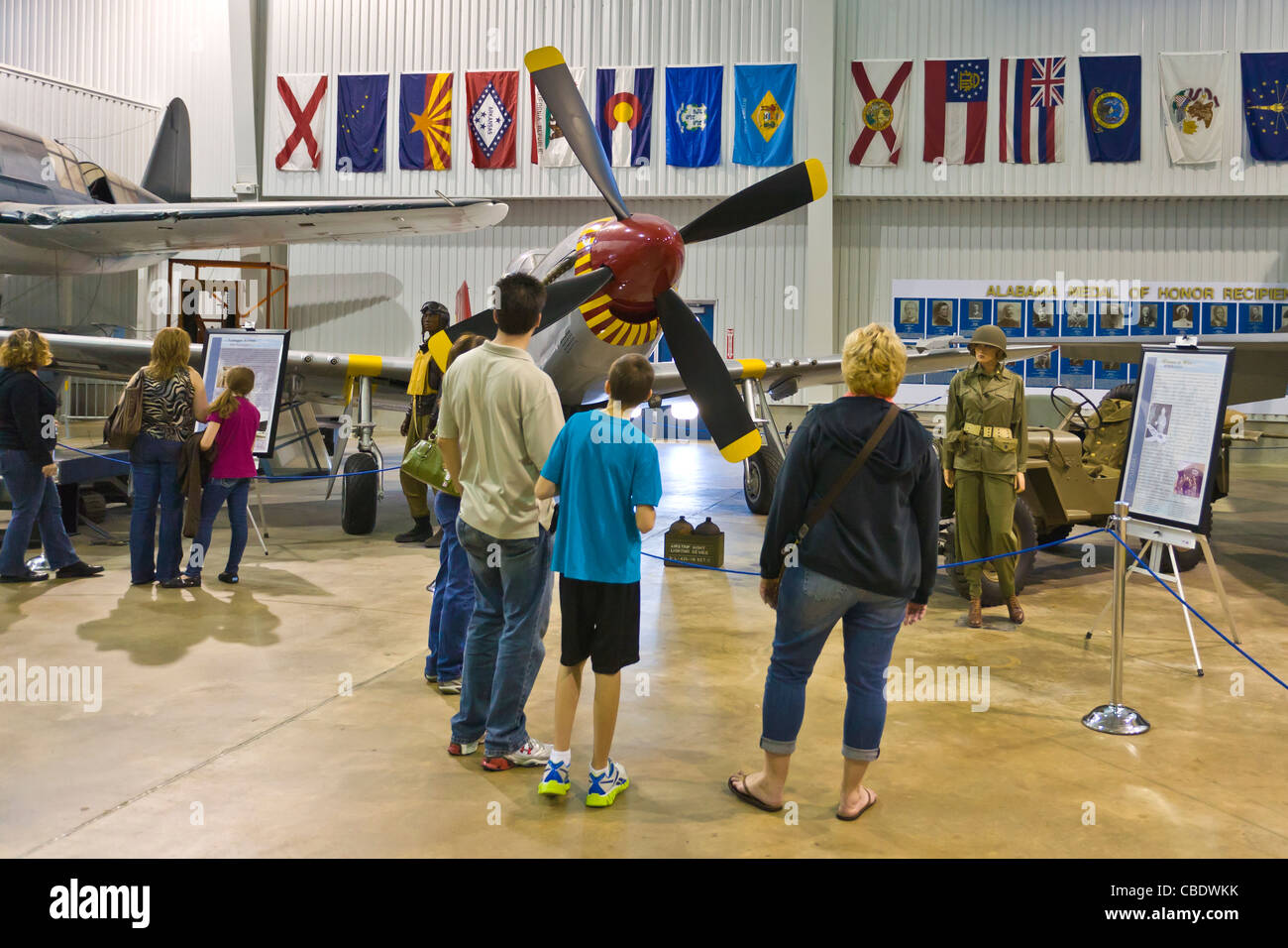 Family looking at planes in the Aircraft museum at the USS Alabama Battleship Park in Mobile Alabama Stock Photo