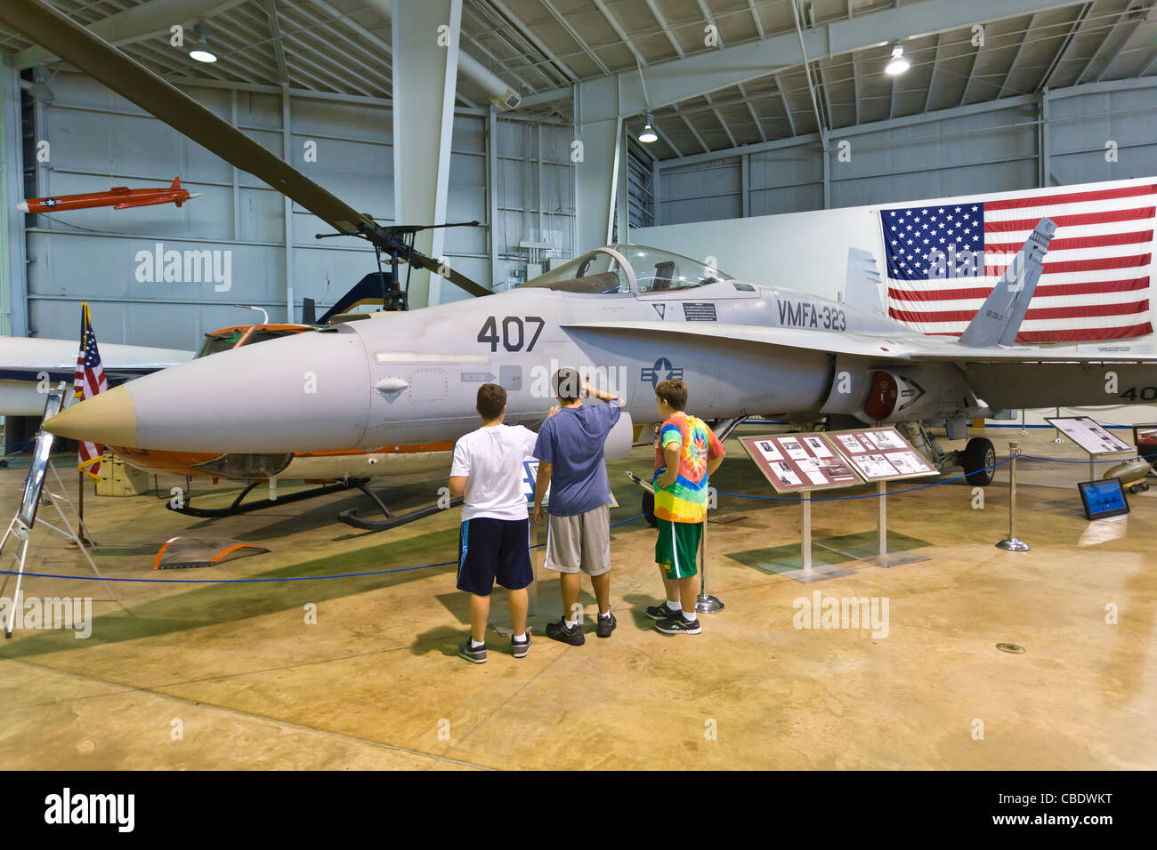 Kids looking at plane in Aircraft museum at the USS Alabama Battleship Park in Mobile Alabama Stock Photo