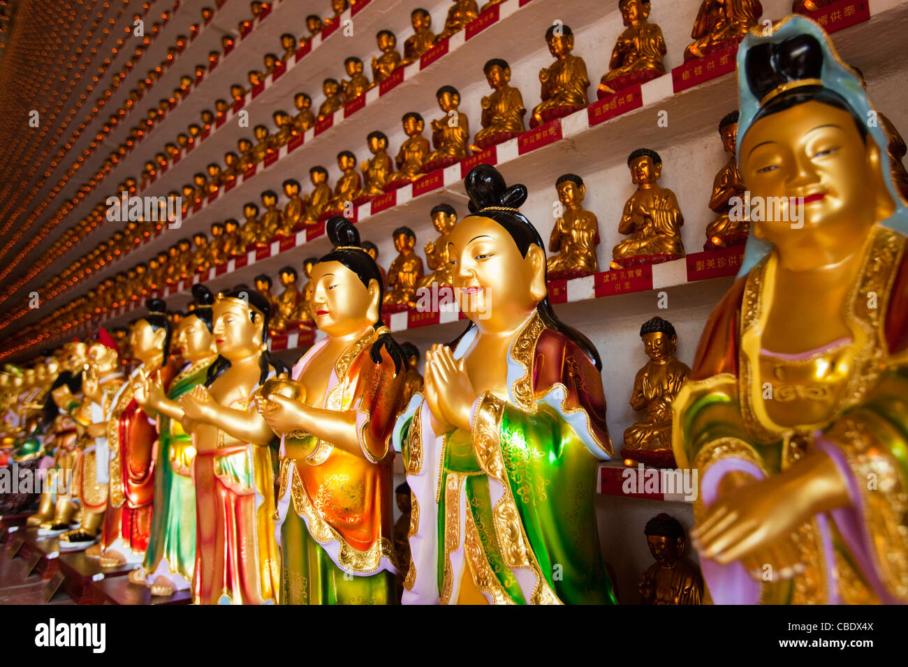 Colorful buddha statues in Chinese shop, Hong Kong, China Stock Photo