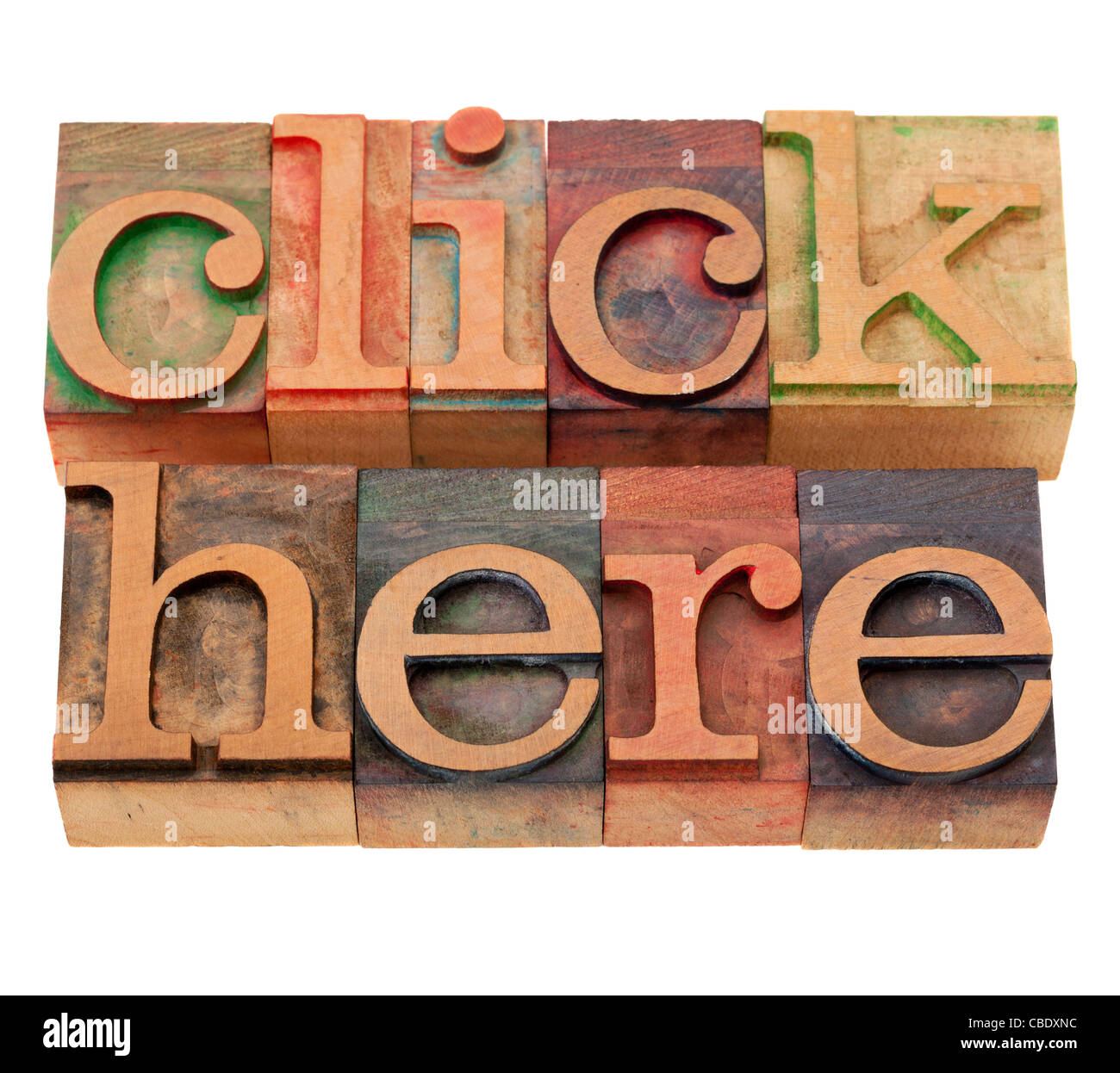 internet concept - click here words in vintage wooden letterpress printing blocks, stained by color inks, isolated on white Stock Photo