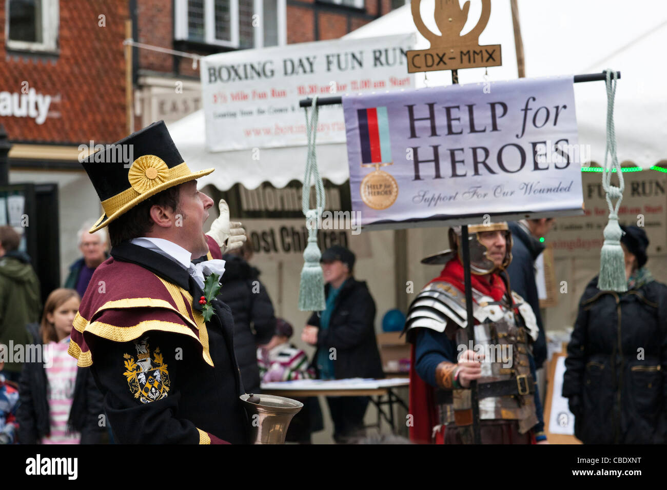 Town crier at the annual Christmas Fair in Haslemere, Surrey, alongside