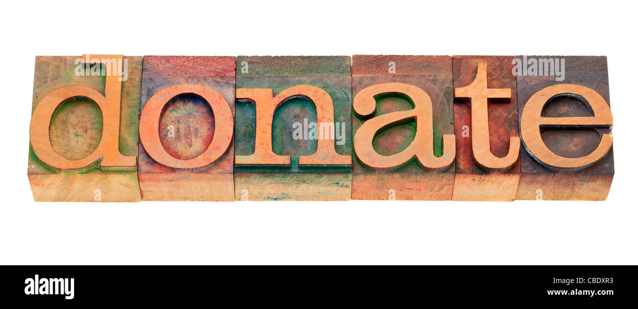 donate - word in vintage wooden letterpress printing blocks, stained by color inks, isolated on white Stock Photo