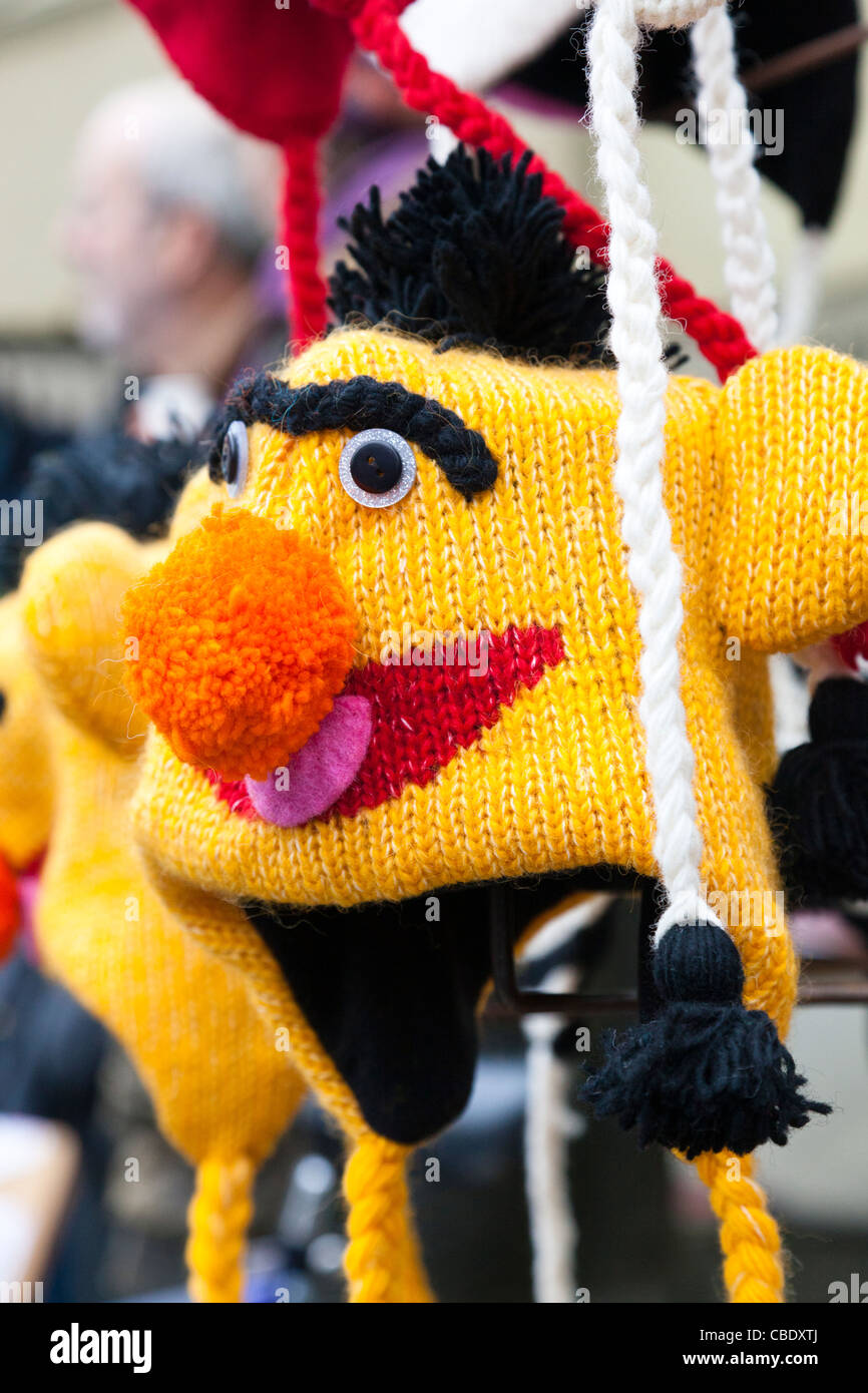 Colourful knitted hat in the form of the Bert character from Sesame Street. Stock Photo