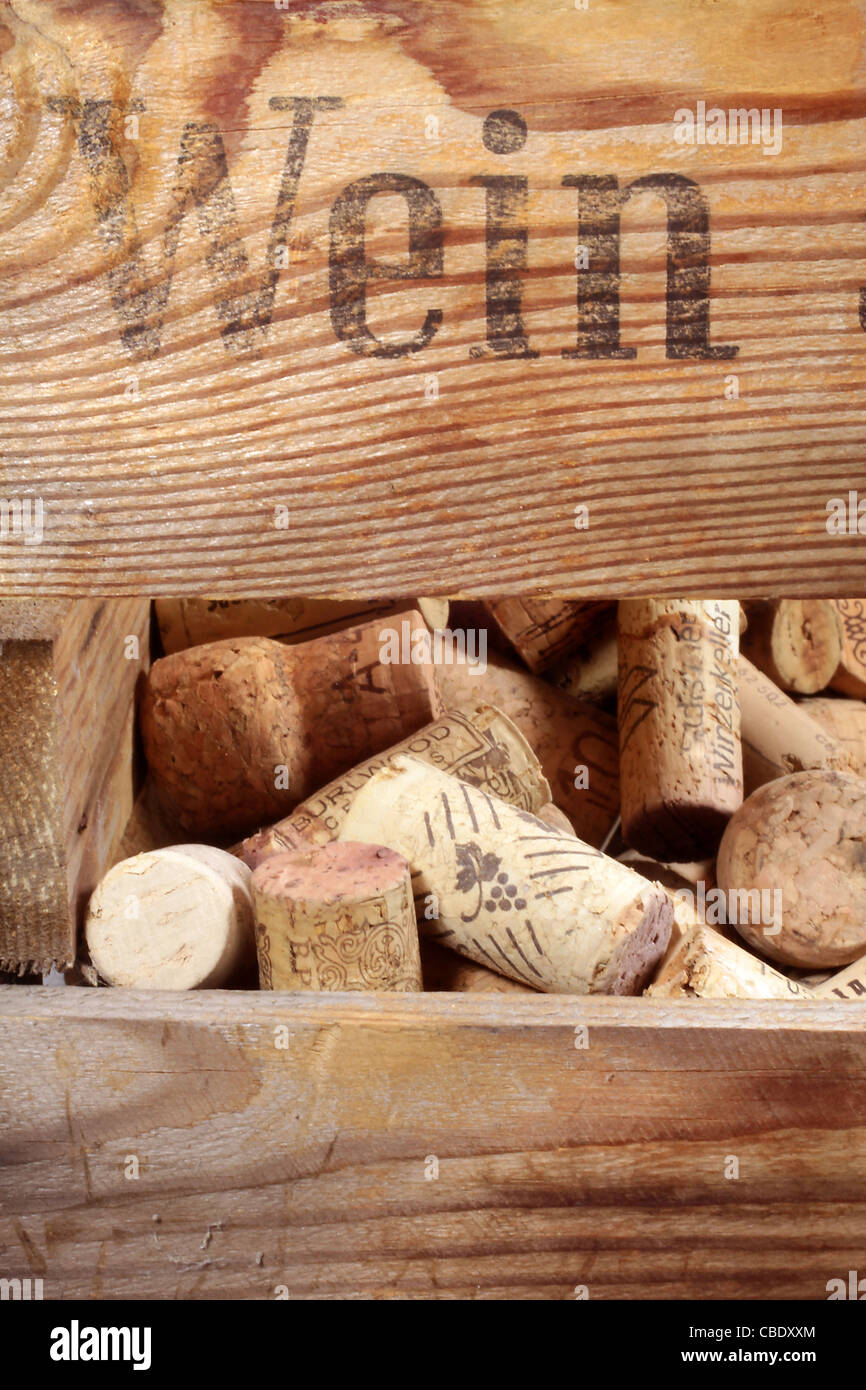 Old wooden wine rack with many corks Stock Photo