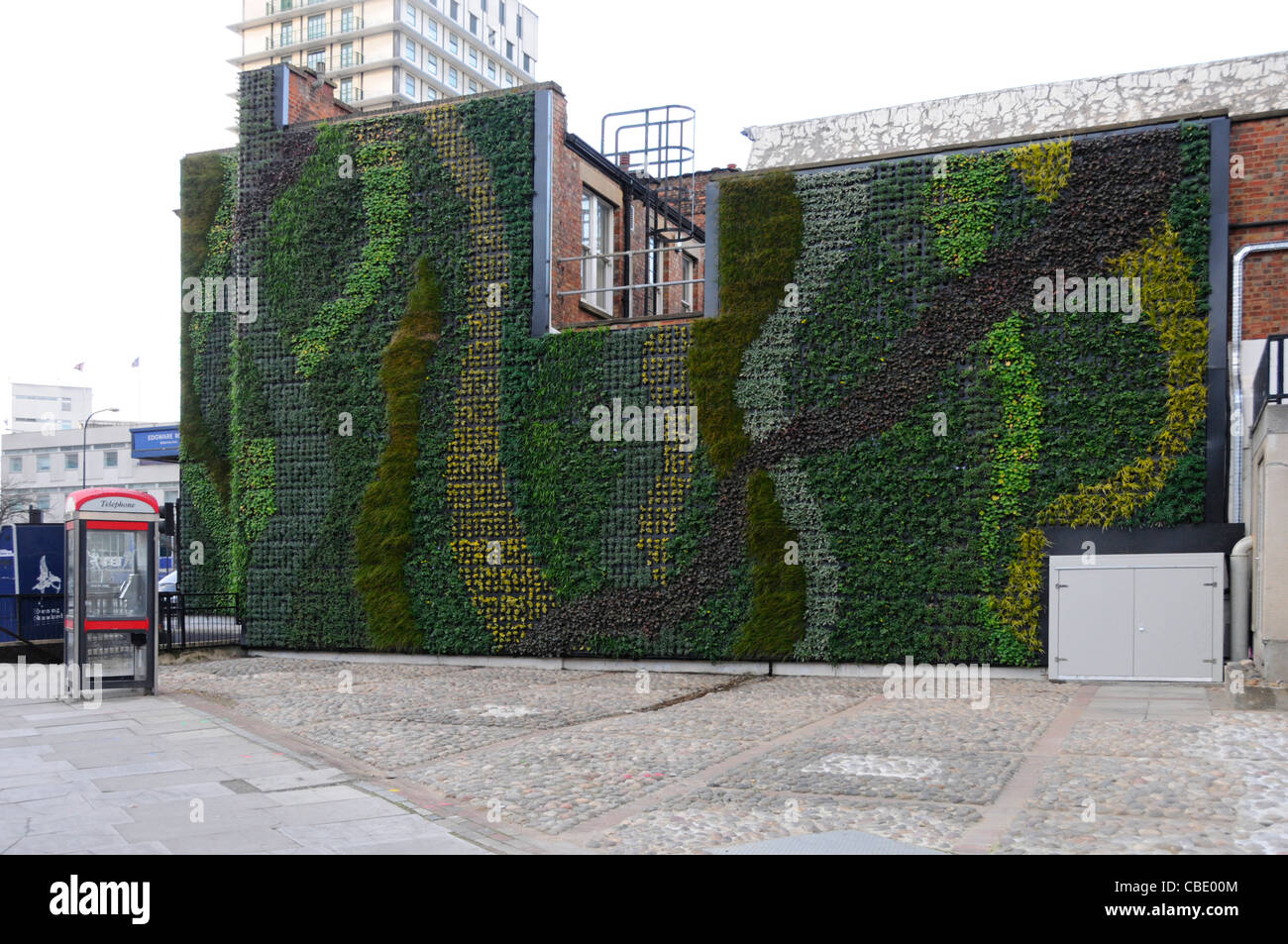 Miami Beach Florida,Collins Avenue,parking garage,Seventh 7th Street Parking  Garage,multi use building,shops,vertical vegetated wall,urban landscape,p  Stock Photo - Alamy