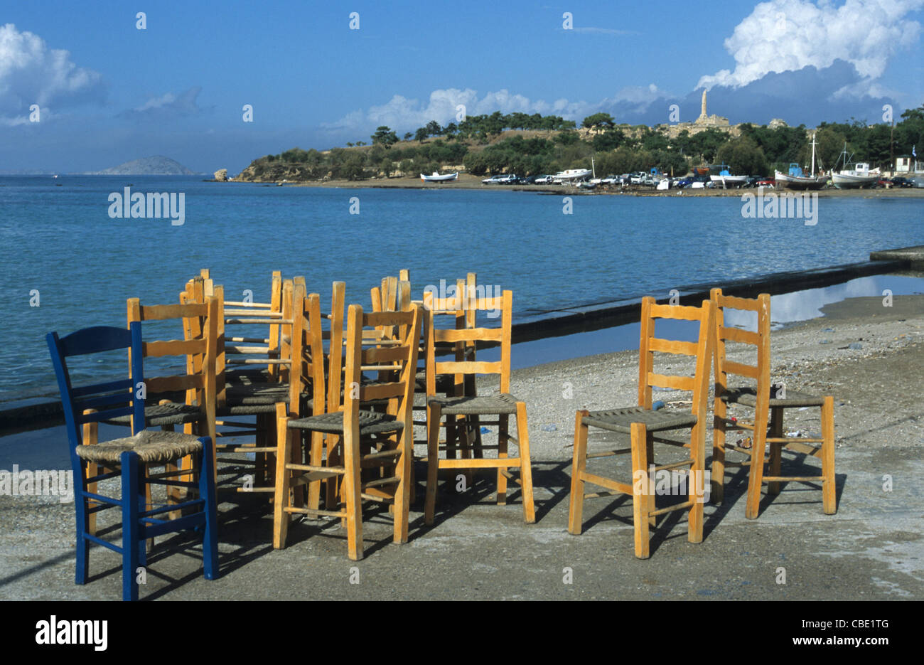 Restaurant chairs on the beach, Aegina Island, Greece Stock Photo
