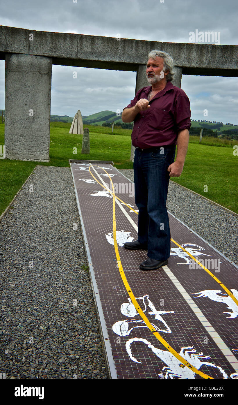 Curator owner explaining astronomical astrological applications Stonehenge Aotearoa Carterton Wairarapa region New Zealand Stock Photo