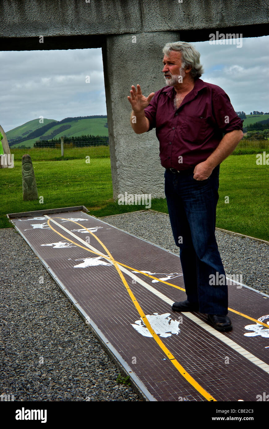 Curator owner explaining astronomical astrological applications Stonehenge Aotearoa Carterton Wairarapa region New Zealand Stock Photo